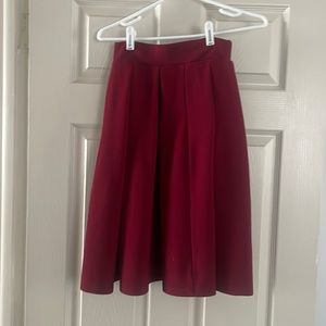 Maroon knee length pleated skirt